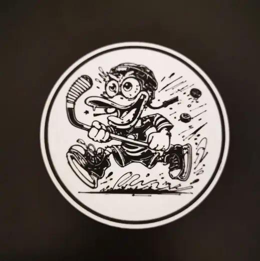 A duck playing hockey coaster