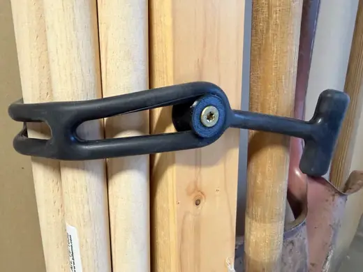 Fastener for rubber tensioner
