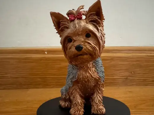 Realistic Yorkshire Terrier Figurine with Bow
