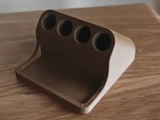 Pen holder with eraser shelf