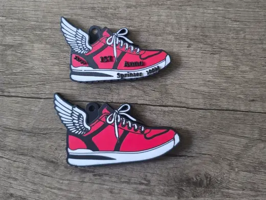 Track shoe with wing keychain