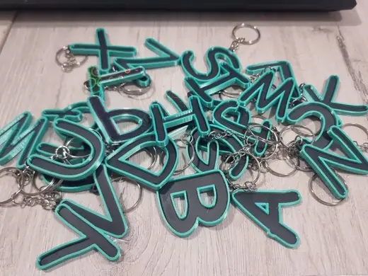 Letters for keychains with raised edge