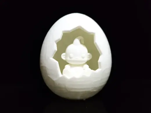 The baby Majin Buu hatching from its shell