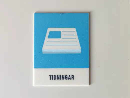 Skylt för tidningar