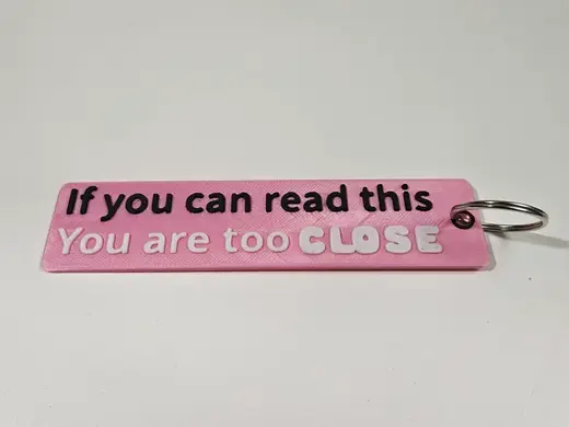 Flame keyring "If you can read, you are too close"
