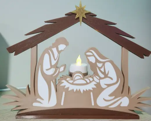 Nativity scene with tealight in the background