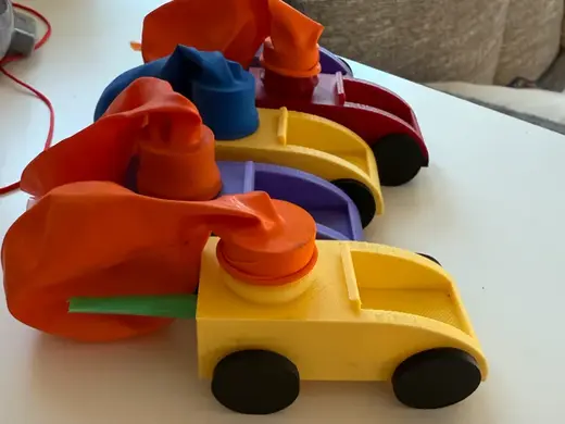 Balloon powered toy car with straw exhaust