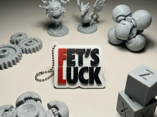 The "Fet's Luck" Wordplay Keychain