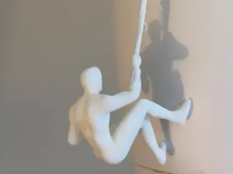 Rope Climber: Hanging Figure Sculpture