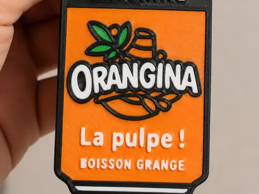 Destapador+llavero orangina bebida